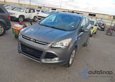 2014 Ford Escape Titanium z USA, uszkodzony, nr VIN 1FMCU0J9XEUD29721